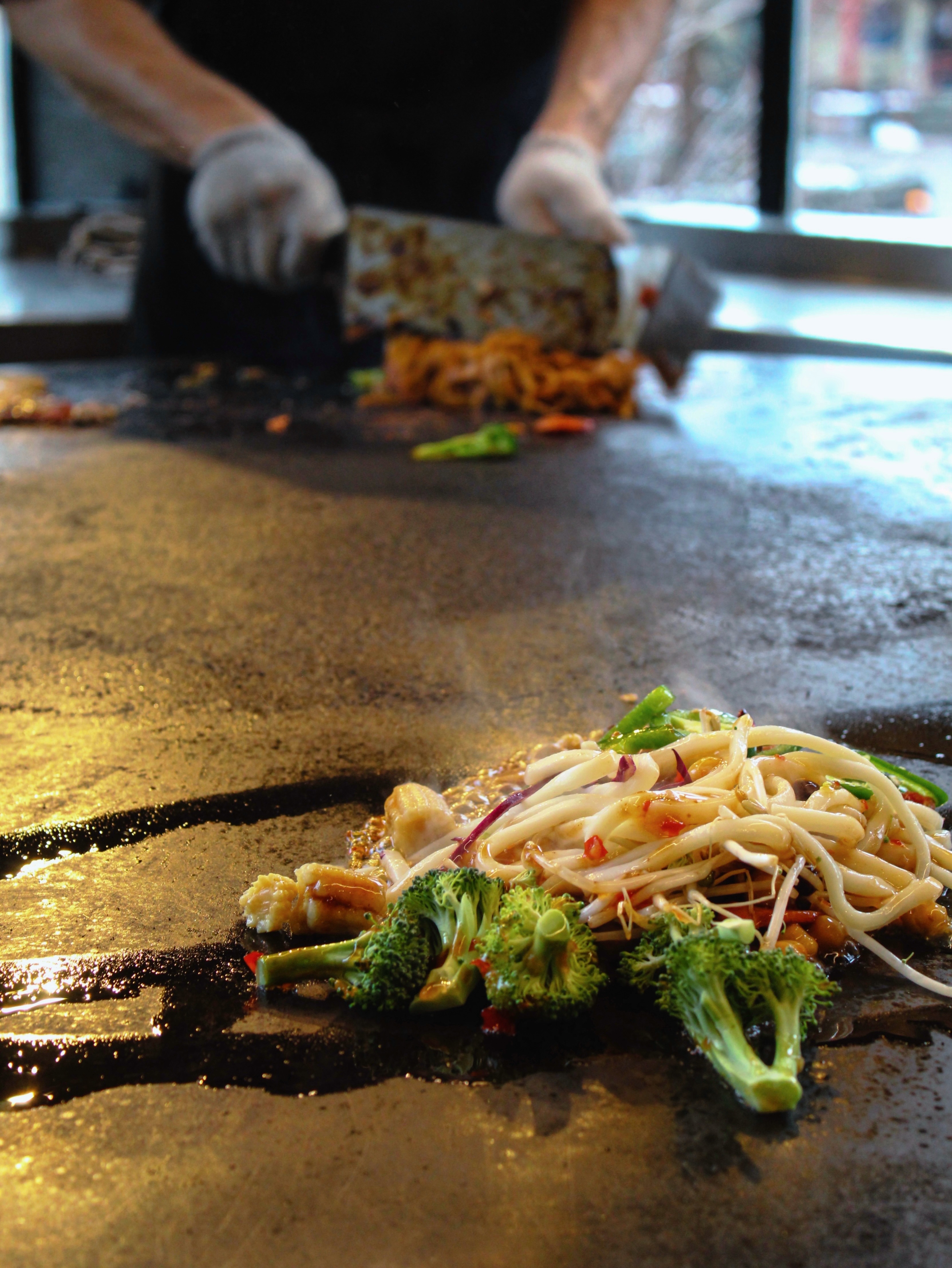 Close-up food sizzling on hot flat-top grill