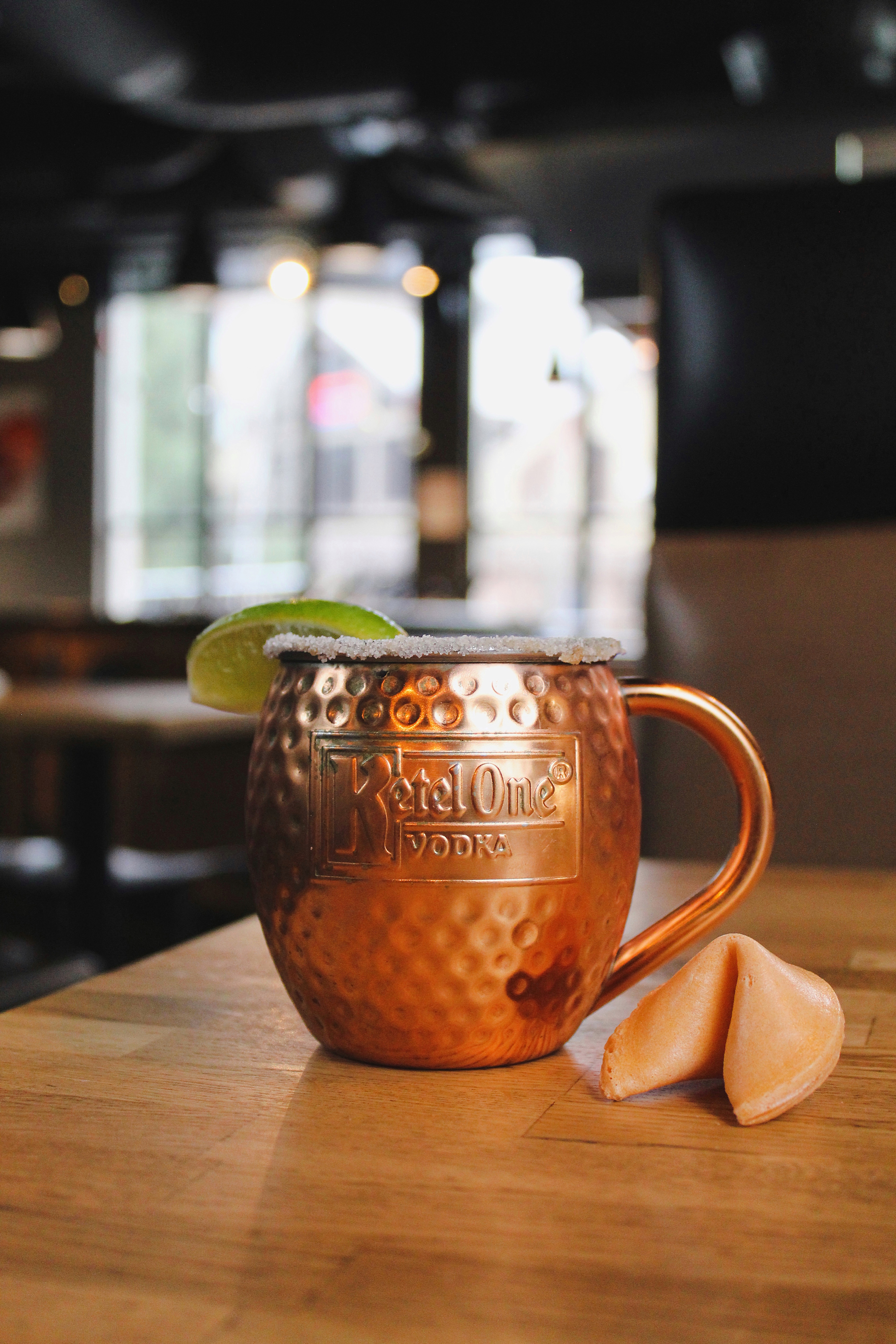 Copper Moscow Mule cocktail with fortune cookie