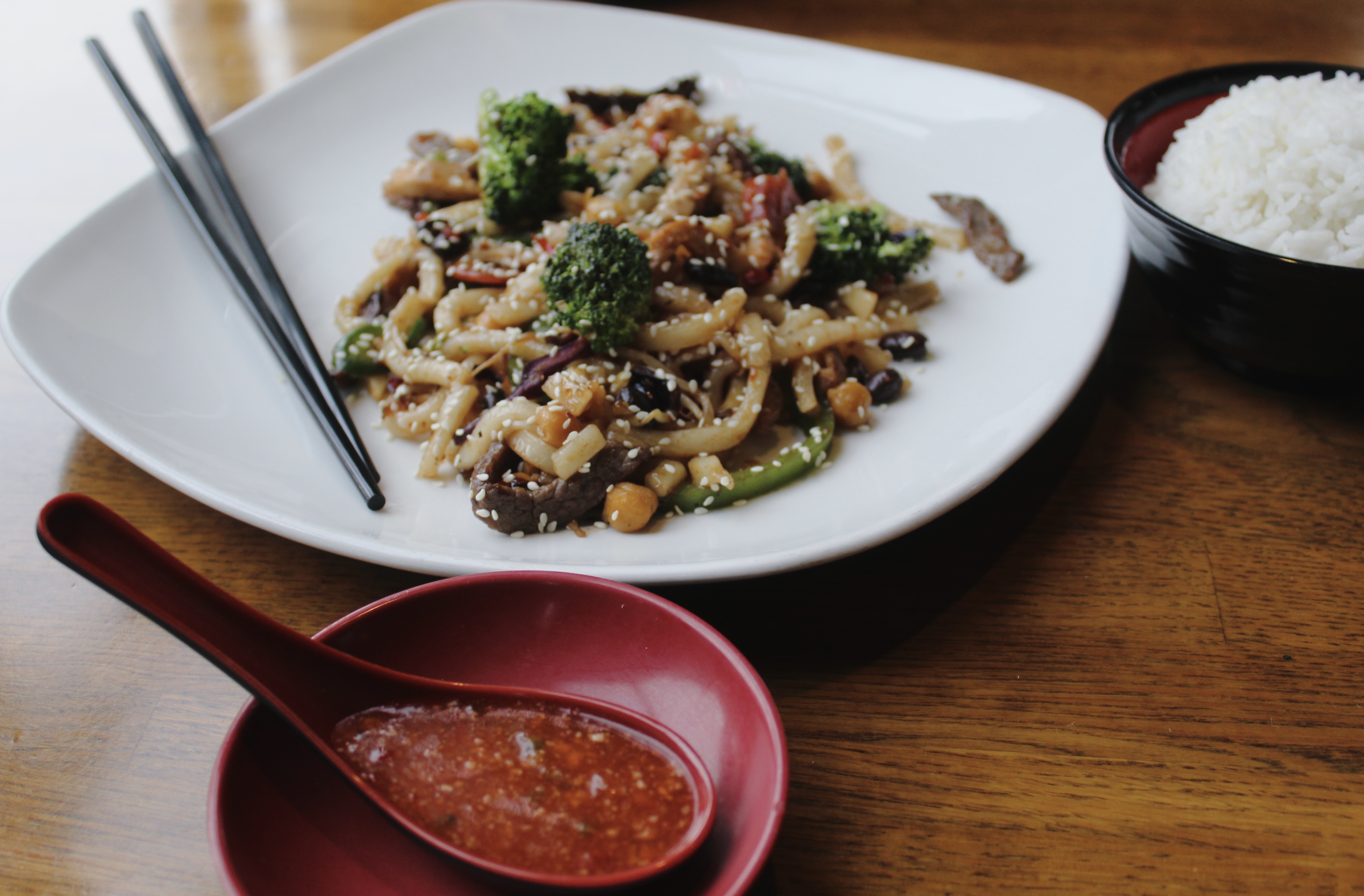 Udon plate with rice, sauce, and chopsticks